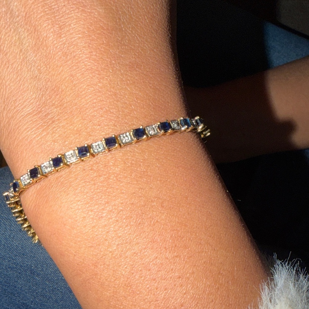Gold diamond and sapphire tennis bracelet